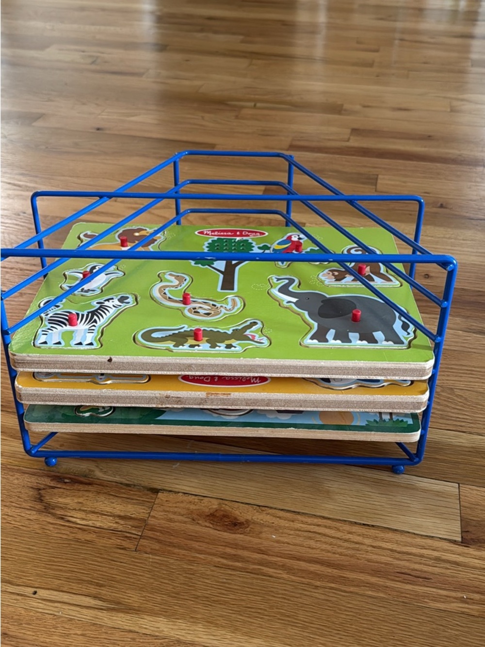 Melissa & Doug Blue Wire Rack with Colorful Animal Peg Puzzles